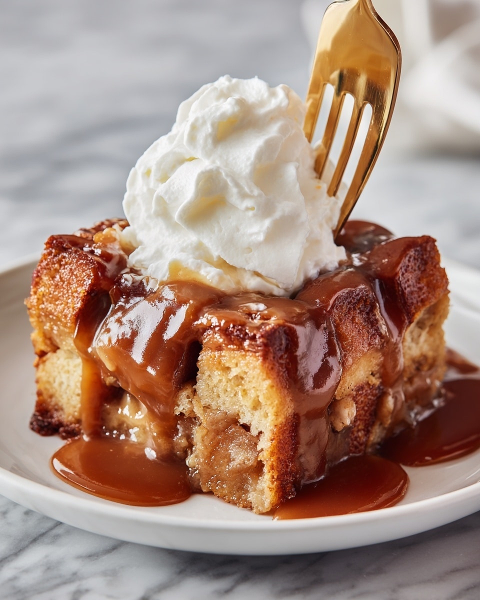 The image shows an oval white dish filled with layers of cubed bread pudding. The bread pieces are golden brown with slightly darker toasted edges, giving a soft and fluffy texture with some crispiness on top. The cubes are piled high and closely packed across the entire dish, showing an even, warm orange-brown color with hints of moist custard soaking through the layers. The dish is set on a white marbled surface that adds a clean and bright contrast to the rich tones of the bread pudding. Photo taken with an iphone --ar 4:5 --v 7