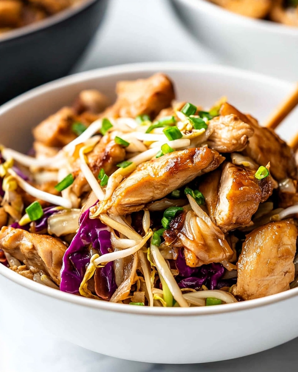 A white speckled bowl filled with three main layers: at the bottom, cooked light brown noodles mixed with small pieces of dark brown mushrooms and purple cabbage strips; in the middle, large light brown pieces of cooked chicken scattered evenly; on top, green chopped spring onions sprinkled all over with a cluster of white bean sprouts on one side. Two light wooden chopsticks rest diagonally on the left side of the bowl, and the whole dish is placed on a white marbled surface with a few green onion pieces and two whole mushrooms nearby. Photo taken with an iphone --ar 4:5 --v 6.1