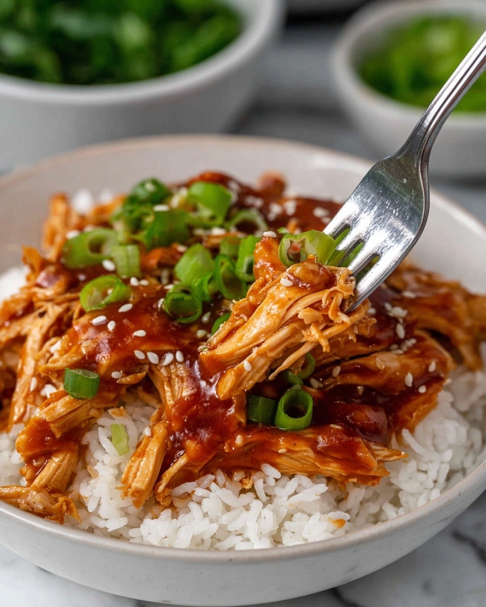 A white bowl filled with a base layer of plain white rice, topped with a thick layer of shredded chicken covered in a shiny reddish-brown sauce. The chicken is sprinkled with small white sesame seeds and chunks of bright green chopped scallions are scattered on top. A silver fork lifts a piece of the sauced chicken with scallions above the bowl. In the background, bowls with green herbs and other ingredients are slightly blurred, all set on a white marbled surface. photo taken with an iphone --ar 4:5 --v 7