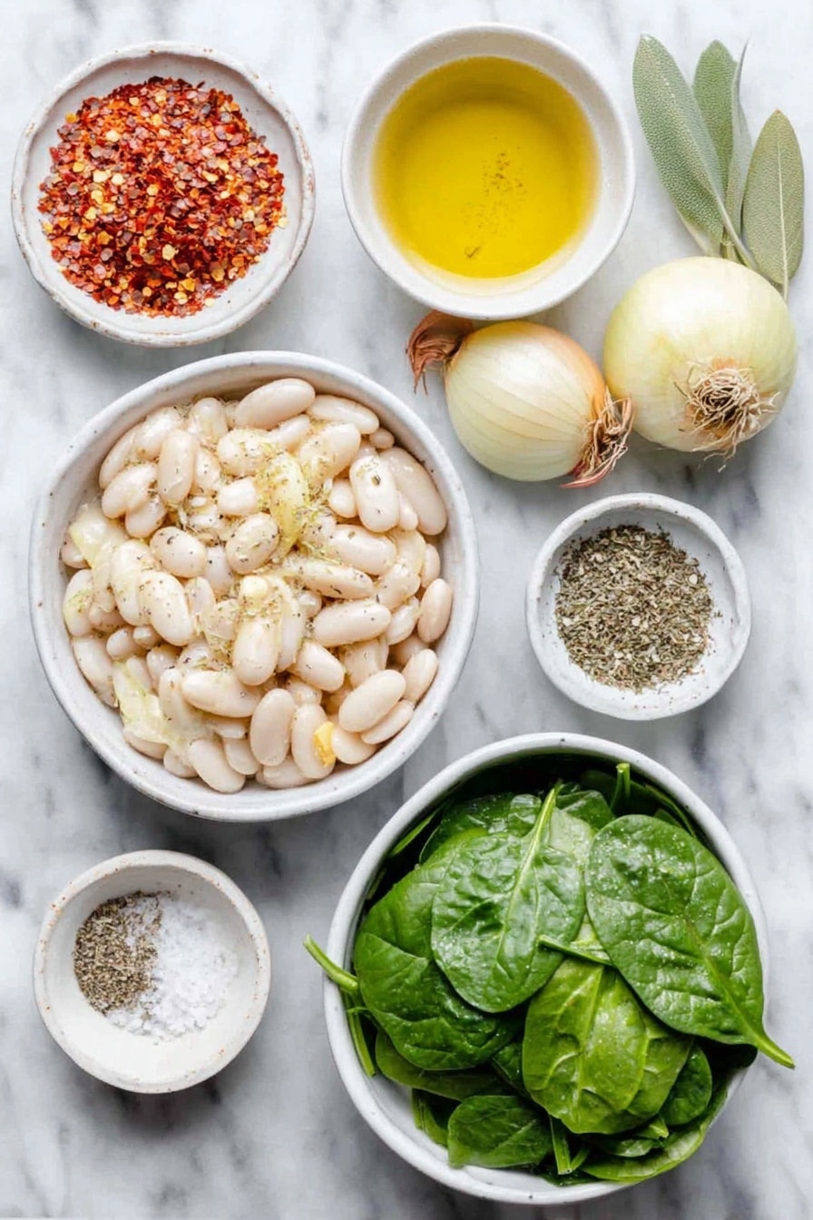 Flat lay of a small white ceramic bowl of extra virgin olive oil, a small peeled onion, two medium shallots with papery skins, four whole garlic cloves, two sliced carrots cut into coins, two diced celery stalks, a large white ceramic bowl of drained white cannellini beans, two fresh green bay leaves, a small white bowl of dried Italian seasoning herbs, a small white bowl of red pepper flakes, a large white ceramic bowl of fresh vibrant green spinach leaves, a small white bowl of coarse sea salt, and a small white bowl of ground black pepper all arranged symmetrically placed on a clean white marble surface, soft natural light, photo taken with an iPhone, professional food photography style, fresh ingredients, white ceramic bowls, no bottles, no duplicates, no utensils, no packaging --ar 2:3 --v 7 --p awthu7i m7354615311229779997 - Hearty Tuscan White Bean Soup, Tuscan White Bean Soup, Italian Bean Soup, Healthy White Bean Soup, Comforting Tuscan Soup