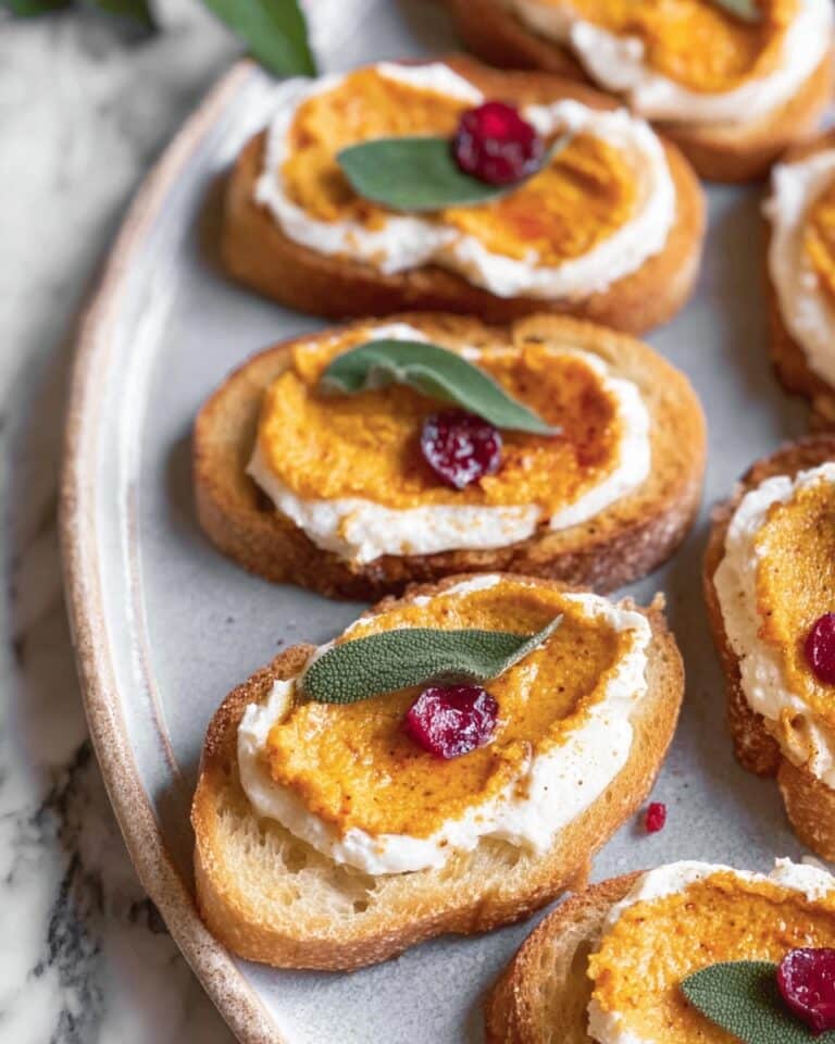 Butternut Squash Crostini with Whipped Goat Cheese and Pickled Cranberries Recipe
