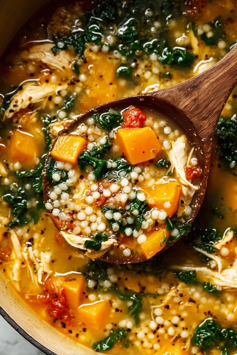A wooden spoon lifts a thick soup filled with three main layers: plump white pearl-like grains scattered throughout, soft bright orange chunks of cooked squash, and wilted dark green leafy vegetables mixed in a light golden broth. The soup also contains pieces of shredded pale yellow chicken and small red tomato chunks, with black and white mustard seeds floating on top, all inside a pot sitting on a white marbled surface. The texture looks rich and hearty with a mix of soft and tender ingredients. Photo taken with an iphone --ar 2:3 --v 7 - Fall Chicken Stew with Quinoa and Butternut Squash, hearty autumn chicken stew, healthy chicken and squash soup, wholesome fall quinoa stew, cozy chicken and vegetable soup