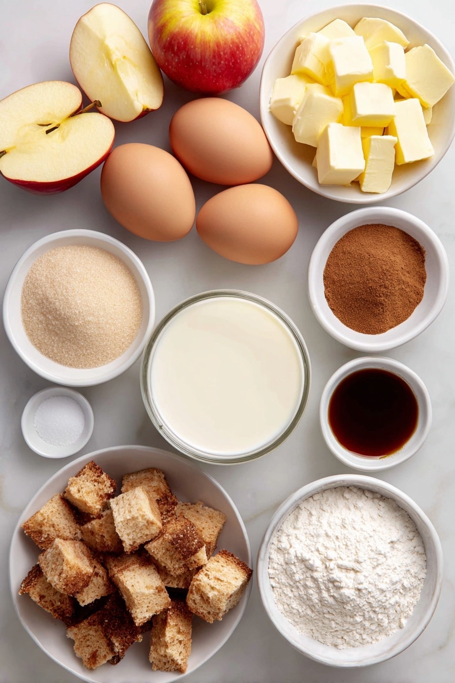 Flat lay of peeled, cored, and sliced fresh apples arranged neatly, diced rustic French bread cubes, six whole large eggs with clean shells, a small white ceramic bowl of whole milk, a small white ceramic bowl of heavy cream, a small white ceramic bowl filled with granulated sugar, a small white ceramic bowl with light brown sugar, a small white ceramic bowl containing all-purpose flour, a small white ceramic bowl holding ground cinnamon, a small white ceramic bowl with ground nutmeg, diced salted butter cubes arranged artfully on a simple white ceramic plate, and a small white ceramic bowl of clear vanilla extract placed symmetrically, all on a clean white marble surface, soft natural light, photo taken with an iPhone, professional food photography style, fresh ingredients, white ceramic bowls, no bottles, no duplicates, no utensils, no packaging --ar 2:3 --v 7 --p awthu7i m7354615311229779997 - Apple French Toast Casserole, Apple French Toast Bake, Easy Apple Breakfast, Cinnamon Apple Brunch, Make-Ahead Breakfast Casserole