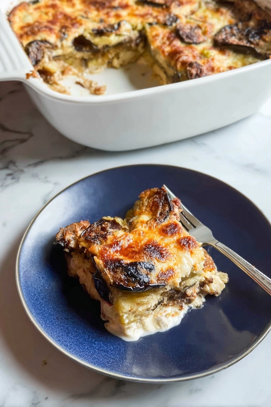 A white casserole dish sits in the background, filled with a baked layered dish that has a golden, slightly browned cheese crust with some darker browned spots, showing eggplant or similar vegetables beneath. In the foreground, a piece of this dish is served on a white plate, showing three visible layers: the top layer is melted golden cheese with some browned spots, the middle layer has slices of dark brown roasted eggplant, and the bottom layer is a white creamy base, possibly cheese or sauce. A fork rests on the plate next to the food. The background surface is a white marbled texture. Photo taken with an iphone --ar 2:3 --v 7 - Healthy Chicken Zucchini Bake, healthy chicken zucchini casserole, low-carb zucchini chicken bake, nutritious chicken and vegetable bake, easy healthy chicken recipes
