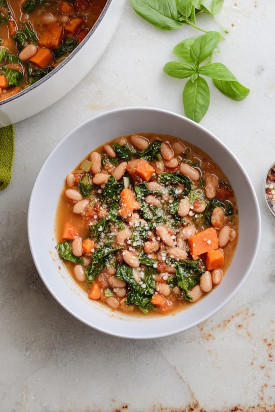 A white bowl filled with a stew made of light brown beans, bright orange carrot pieces, and green leafy vegetables in a light brown broth. Small white grains sprinkled on top add texture. To the top left, part of a white pot with the same stew is visible. Fresh green basil leaves lie beside the bowl on a white marbled surface with some scattered leaves and crumbs around it. photo taken with an iphone --ar 2:3 --v 7 - Cranberry Bean Soup, hearty bean soup, healthy soup recipes, vegetarian bean soup, easy soup recipes