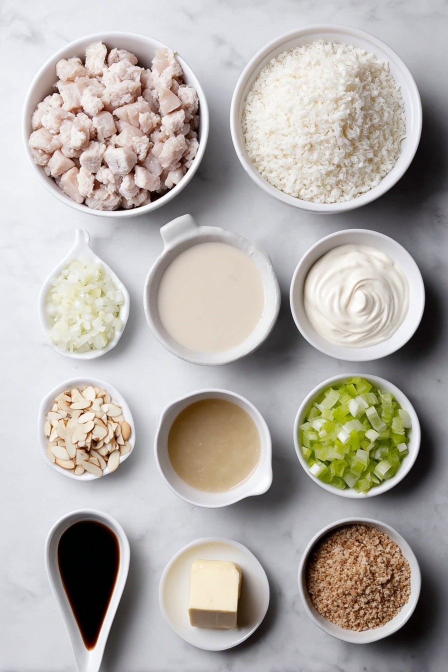 Flat lay of cooked diced turkey pieces, cooked white rice grains in a small white ceramic bowl, a small white bowl of creamy condensed mushroom soup, a small white bowl filled with clear chicken broth, a small white bowl with smooth, pale mayonnaise, a small white bowl holding thick, white sour cream, a small pile of finely diced small onion, a small pile of finely diced celery stalks, a heap of slivered almonds, a small white bowl containing coarse crushed Ritz cracker crumbs, and a small white bowl with melted golden butter, all ingredients fresh and natural, arranged symmetrically in perfect proportions in simple white ceramic bowls, placed on a clean white marble surface, soft natural light, photo taken with an iPhone, professional food photography style, fresh ingredients, white ceramic bowls, no bottles, no duplicates, no utensils, no packaging --ar 2:3 --v 7 --p m7354615311229779997 - Leftover Turkey Rice Casserole, Turkey leftover recipes, easy casserole with turkey, creamy turkey casserole, Thanksgiving leftovers dinner