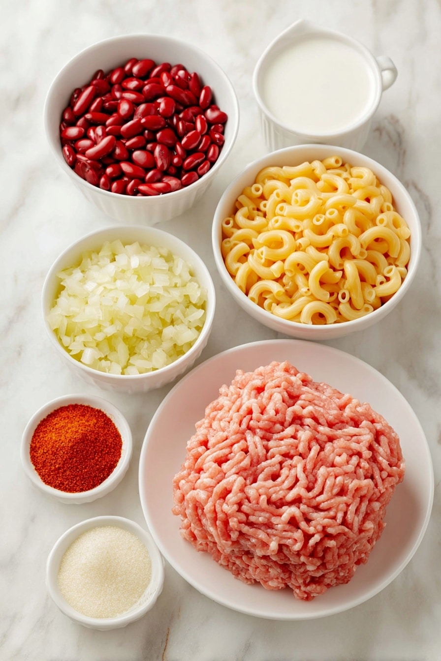 Flat lay of fresh raw ground turkey shaped into a neat mound, a medium yellow onion finely diced in a small white ceramic bowl, a small white bowl filled with bright red kidney beans, a small white bowl of vibrant red tomato sauce, a small white bowl containing golden whole grain elbow macaroni, a small white bowl with smooth white milk, a small white bowl holding shredded sharp cheddar cheese in vivid orange-yellow hues, a small white bowl of chili powder in rich deep red, a small white bowl of minced fresh garlic with a pale creamy color, all ingredients arranged symmetrically with perfect balance and fresh natural textures, placed on a clean white marble surface, soft natural light, photo taken with an iPhone, professional food photography style, fresh ingredients, white ceramic bowls, no bottles, no duplicates, no utensils, no packaging --ar 2:3 --v 7 --p m7354615311229779997 - Turkey Chili Mac and Cheese, Turkey Chili Mac and Cheese recipe, comforting turkey pasta, one-pot turkey chili mac, healthy ground turkey dinner