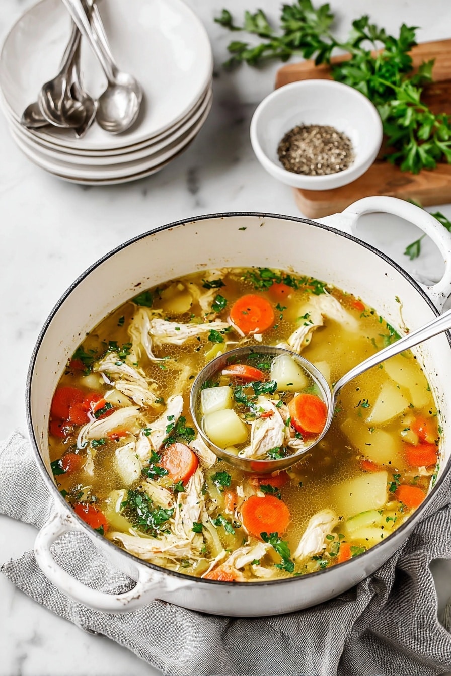 A big white pot filled with light brown clear broth with many ingredients floating in it, including shredded white chicken pieces, round orange carrot slices, small white potato chunks, and small green celery pieces. Fresh green parsley leaves are sprinkled on top, and some black pepper is visible in the broth. A silver ladle is resting inside the pot, partly submerged in the soup, revealing a close-up of the vegetable and chicken mix. The pot sits on a grey cloth on a white marbled surface with a small white bowl of black pepper in the upper left corner. Photo taken with an iphone --ar 2:3 --v 7 - Ultimate Chicken Soup, comforting chicken soup recipe, hearty chicken soup, easy chicken soup, homemade chicken soup