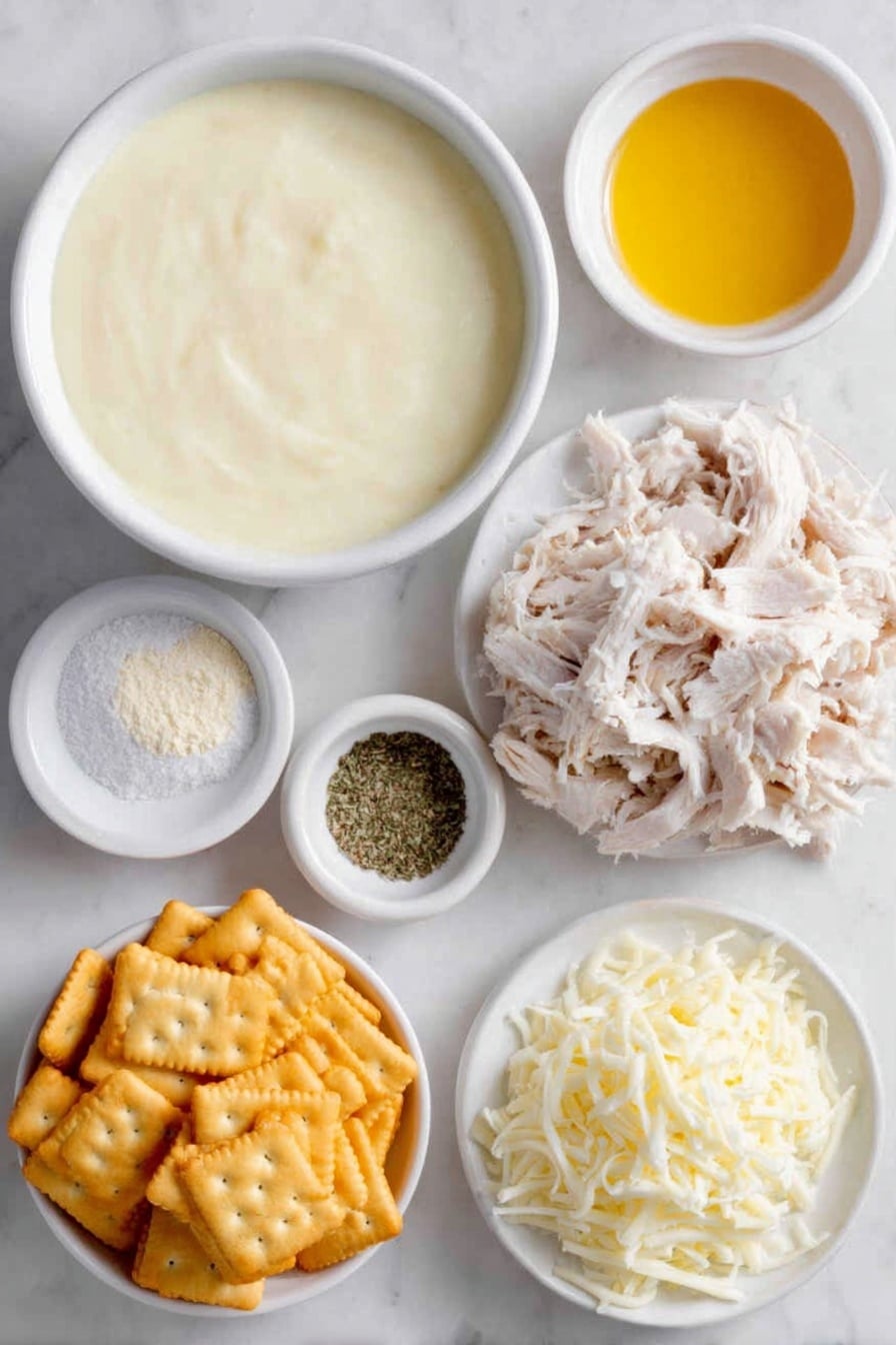 Flat lay of two white ceramic bowls—one filled with thick creamy condensed cream of chicken soup, the other holding smooth sour cream; a small white bowl with fine pale onion powder, another small white bowl with powdery garlic powder; a small white bowl containing coarse kosher salt next to a small white bowl with ground black pepper; a heaping pile of shredded cooked chicken arranged neatly; a mound of shredded sharp cheddar cheese; a small white bowl holding melted golden butter; and a cluster of lightly crushed shiny golden Ritz crackers, all placed on a clean white marble surface, soft natural light, photo taken with an iPhone, professional food photography style, fresh ingredients, white ceramic bowls, no bottles, no duplicates, no utensils, no packaging --ar 2:3 --v 7 --p awthu7i m7354615311229779997 - Creamy Chicken Casserole, easy chicken casserole, comforting chicken dinner, cheesy chicken bake, family-friendly casserole
