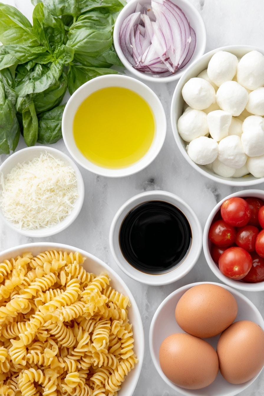 Flat lay of cavatappi pasta twisted spirals, a small white bowl of extra-virgin olive oil glistening, a small white bowl of fresh lemon juice pale yellow, a small white bowl of dark balsamic vinegar, a small white bowl of finely grated pecorino cheese light off-white, a few garlic cloves whole and peeled, a small pile of coarse sea salt crystals, a few twists of freshly ground black pepper, a handful of halved bright red cherry tomatoes, several halved mini mozzarella balls pure white and smooth, thinly sliced rings of red onion vibrant purple, a heaping handful of fresh basil leaves deep green torn and whole, several whole brown eggs with clean shells placed nearby, all arranged symmetrically on simple white ceramic bowls and plates, placed on a clean white marble surface, soft natural light, photo taken with an iPhone, professional food photography style, fresh ingredients, white ceramic bowls, no bottles, no duplicates, no utensils, no packaging --ar 2:3 --v 7 --p m7354615311229779997 - Caprese Pasta Salad with Fresh Tomatoes, easy summer pasta salad, cherry tomato pasta salad, mozzarella basil pasta, quick Italian pasta salad