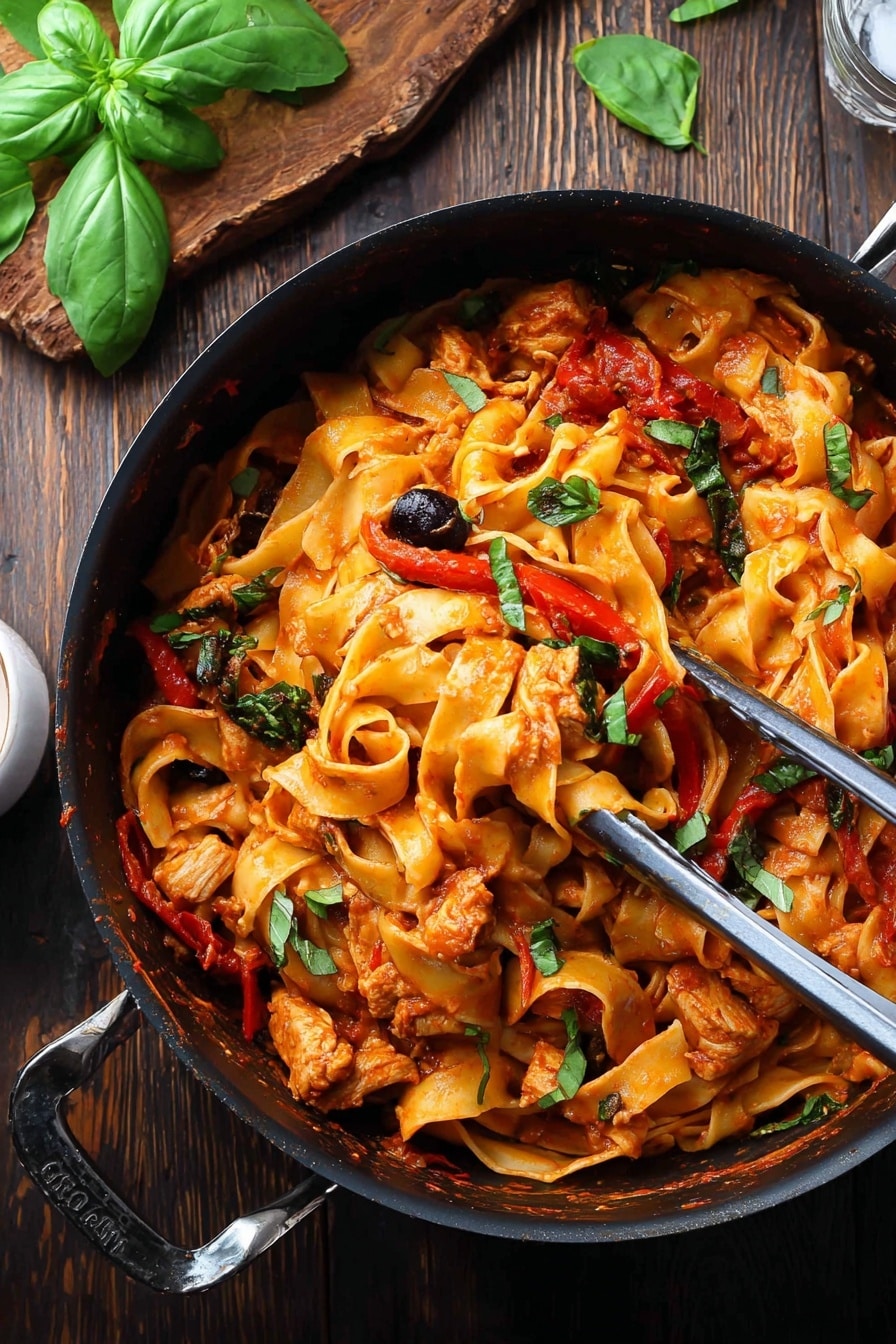 A black pot filled with wide, flat pasta ribbons coated in a rich orange-red tomato sauce mixed with pieces of cooked chicken, strips of red bell pepper, black olives, and green herb leaves scattered around. Metal tongs rest inside the pot, lightly lifting some pasta and chicken. The pot is placed on a dark wooden table with fresh green basil leaves on a wooden board in the background. The scene has a rustic and hearty feel. photo taken with an iphone --ar 2:3 --v 7 - Chicken Cacciatore Pasta, Italian chicken pasta, hearty chicken pasta recipes, braised chicken with pasta, comforting Italian dinner