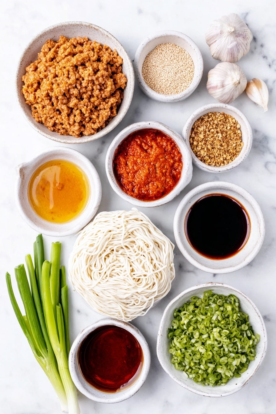 Flat lay of a small white ceramic bowl of creamy Chinese sesame paste, a small white bowl of vibrant red Chinese chili paste in oil, a small white bowl of dark light soy sauce, two whole uncracked garlic cloves, a small white bowl of fine white sugar, a small white bowl of Chinese five spice powder, a small white bowl of ground Sichuan pepper powder, a small white bowl of bright red chili oil, a small white bowl of golden chicken broth, a small white bowl of glossy dark hoisin sauce, a small white bowl of dark soy sauce, a small white bowl of clear Chinese cooking wine, a small white bowl of vegetable oil, a neat pile of fresh pale pink ground pork mince, a small white bowl of finely chopped preserved mustard greens, a nest of fresh white medium-thickness noodles, several fresh green choy sum stems cut into 15cm pieces, two whole green onions finely sliced, and a small white bowl of finely chopped peanuts, all arranged symmetrically on a clean white marble surface, soft natural light, photo taken with an iPhone, professional food photography style, fresh ingredients, white ceramic bowls, no bottles, no duplicates, no utensils, no packaging --ar 2:3 --v 7 --p m7354615311229779997 - Spicy Dan Dan Noodles with Pork, Sichuan Dan Dan Noodles, Homemade Dan Dan Noodles, Pork and Chili Oil Noodles, Authentic Sichuan Noodles