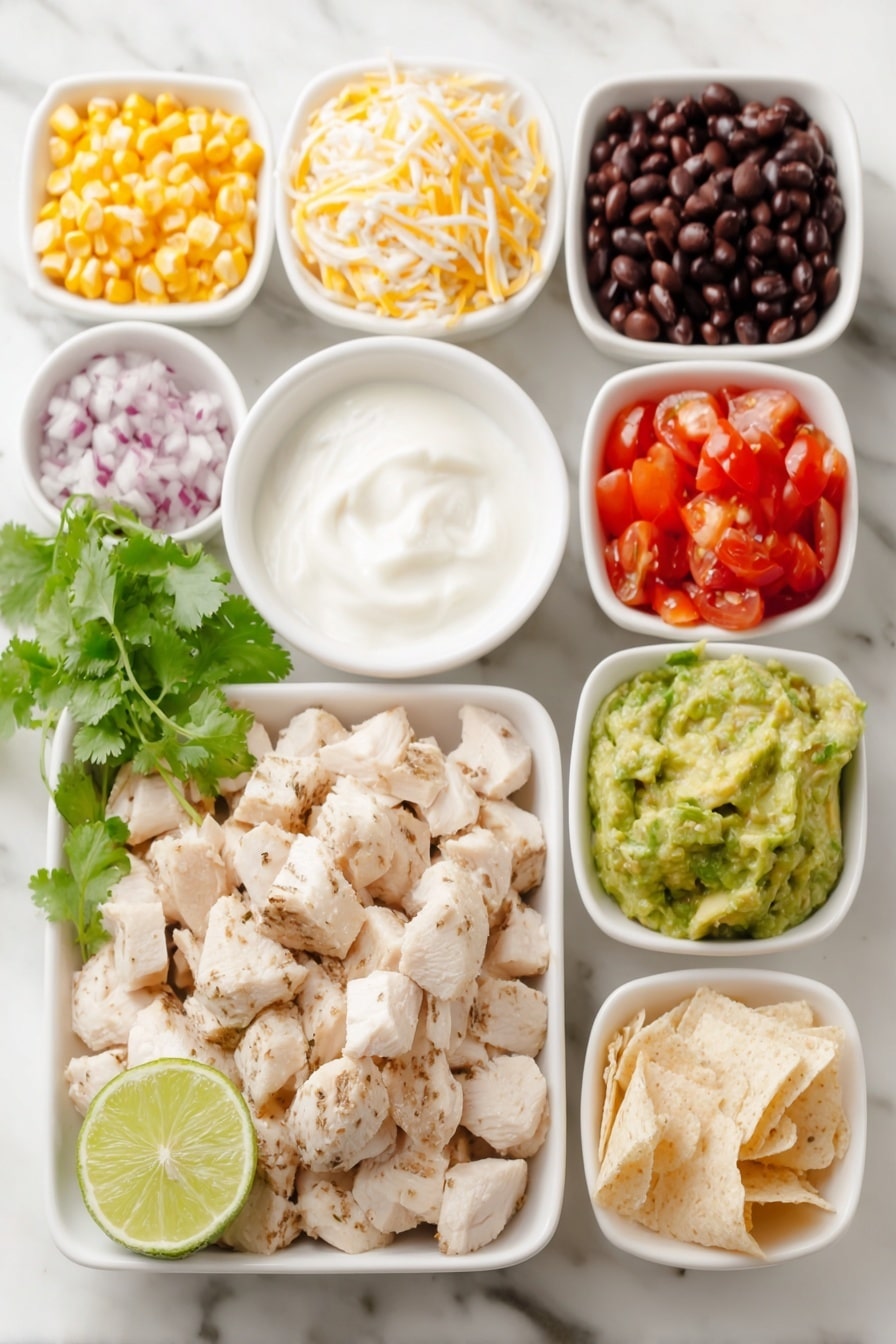 Flat lay of cubed cooked chicken breast, a small bowl of black beans, a small bowl of corn kernels, a small bowl of diced tomatoes, a small bowl of diced red onion, a small bowl of shredded cheddar cheese, a few sprigs of fresh cilantro, a small bowl of plain Greek yogurt, a small bowl of low sugar BBQ sauce, a halved lime with visible juice, diced avocado pieces, and a small pile of crushed tortillas, all arranged symmetrically in simple white ceramic bowls and plates, placed on a clean white marble surface, soft natural light, photo taken with an iPhone, professional food photography style, fresh ingredients, white ceramic bowls, no bottles, no duplicates, no utensils, no packaging --ar 2:3 --v 7 --p m7354615311229779997 - Southwest Chicken Salad with Black Beans, Southwest chicken salad, black beans salad, healthy chicken salad, easy Southwest salad