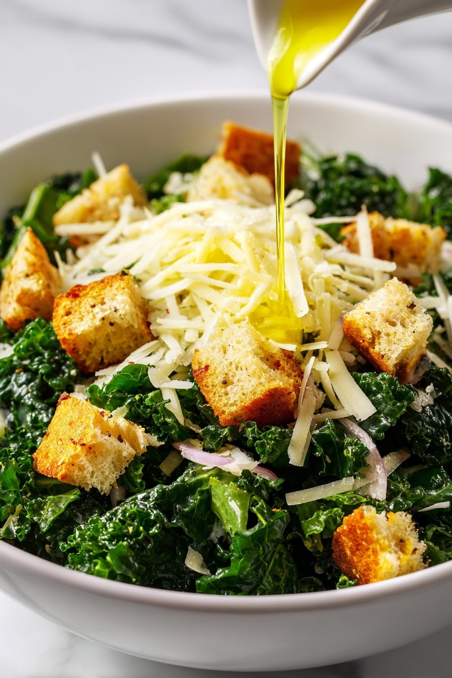 This image shows a close-up of a fresh salad in a white bowl on a white marbled surface. The salad has three main layers: at the bottom is a layer of dark green chopped kale with a textured surface, on top of that are golden-brown croutons scattered all over, and the final layer is shredded pale yellow cheese sprinkled evenly, mixed with small bits of light pink onion. A thin stream of yellow olive oil is being poured over the cheese at the center of the bowl. The photo is vibrant and detailed, focusing closely on the textures of the salad. photo taken with an iphone --ar 2:3 --v 7 - Toasted Bread Parmesan Kale Salad, healthy kale salad with crunchy breadcrumbs, easy kale salad recipes, flavorful vegetable salads, quick vegetable salads