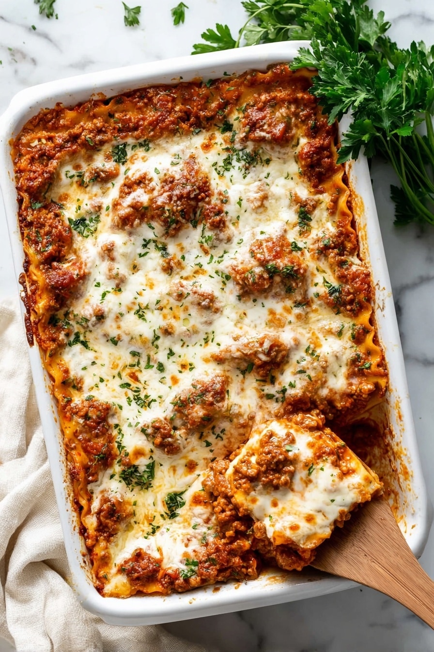 A close-up view of a lasagna dish inside a white baking dish, showing multiple layers of pasta, meat sauce, and melted white cheese on top. The top cheese layer is smooth and creamy with hints of browned spots and small green herb pieces sprinkled across. The meat sauce looks rich and chunky with a reddish-brown color mixed with bits of orange from melted cheese inside. A wooden spoon is lifting a portion, revealing several pasta sheets coated in sauce and melted cheese, with the woman's hand holding the spoon partly visible on the right side. The dish sits on a white marbled surface. photo taken with an iphone --ar 2:3 --v 7 - Baked Ravioli with Meat and Mozzarella, cheesy baked ravioli, meat-filled baked pasta, easy ravioli casserole, family-friendly baked ravioli