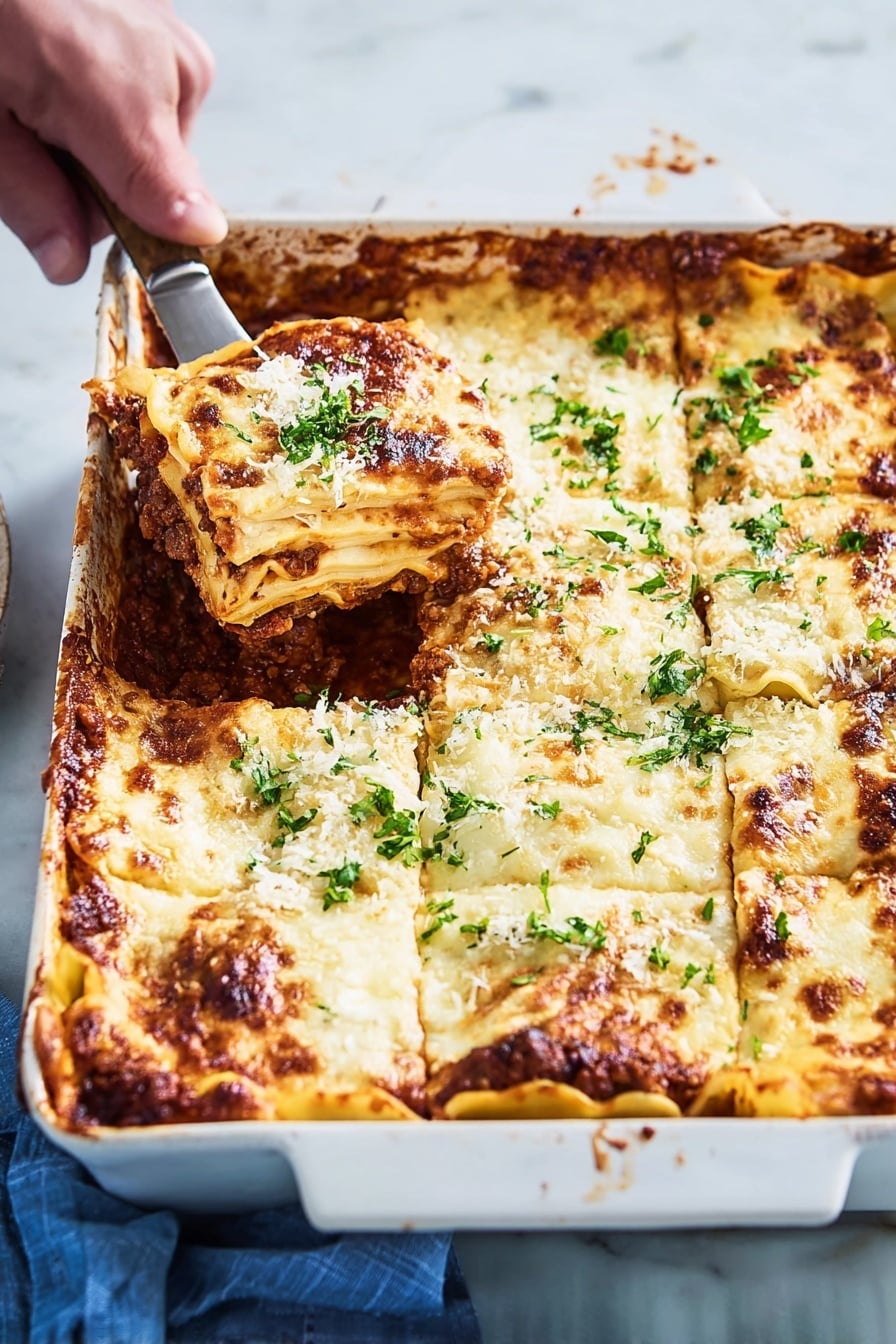 A white rectangular ceramic baking dish holds a layered lasagna with six visible sections. The top layer is melted, golden-brown cheese with some darker browned spots along the edges and sprinkled with fresh green parsley. Underneath the cheese, there are thick, creamy white sauce layers alternating with pasta sheets, visible along the edges where the cheese has browned. Between the pasta layers, a rich dark brown meat sauce with a slightly chunky texture peeks through the sides. A woman's hand is holding a spatula lifting one lasagna piece from the top left corner, showing the thick layers clearly. The dish rests on a white marbled surface with a blue cloth partially visible on the side photo taken with an iphone --ar 2:3 --v 7 - Zucchini Lasagna with Meat Sauce, healthy zucchini lasagna, low-carb zucchini lasagna, meat sauce lasagna, veggie-packed lasagna