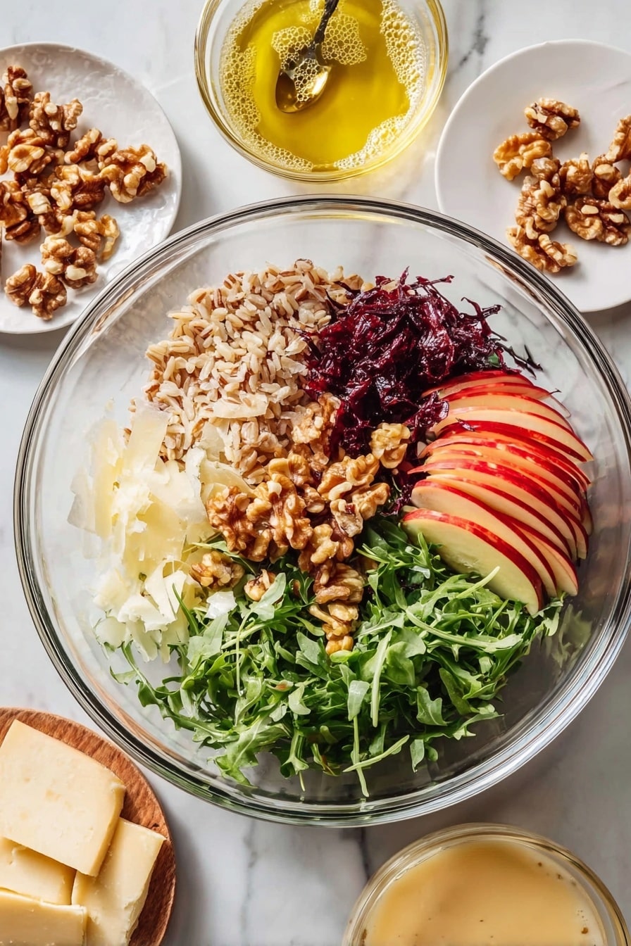A clear glass bowl with six distinct layers: thin red apple slices with skin on at the bottom right, fresh green arugula leaves on the far right, dark red shredded cabbage below the apple slices, light shaved cheese slices at the bottom left, golden brown walnut pieces piled in the center, chopped dark reddish-brown dates with a slightly shiny texture above the walnuts, and a pile of light brown cooked grains filling the top center. Around the bowl on a white marbled surface are three small round white plates holding more walnut pieces, thin cheese slices, and a creamy beige sauce in a glass bowl with a spoon. Nearby is another glass bowl containing a light yellow oil with bubbles. Photo taken with an iphone --ar 2:3 --v 7 - Nutty Farro Salad with Apples and Arugula, healthy farro salad, apple and arugula salad, chewy farro salad recipe, nutty grain salad