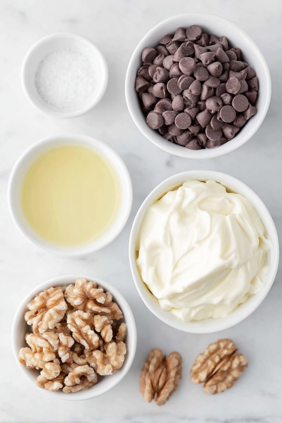 Flat lay of a small mound of glossy semi-sweet chocolate chips, a small white ceramic bowl filled with thick creamy sweetened condensed milk, a small white ceramic bowl with clear golden vanilla extract liquid, a small white ceramic bowl containing fine white sea salt, a small white ceramic bowl heaped with roughly chopped fresh walnuts, and a few whole walnuts scattered nearby, all arranged in perfect symmetry on a clean white marble surface, soft natural light, photo taken with an iPhone, professional food photography style, fresh ingredients, white ceramic bowls, no bottles, no duplicates, no utensils, no packaging --ar 2:3 --v 7 --p m7354615311229779997 - Chocolate Walnut Fudge, chocolate walnut fudge recipe, easy fudge with walnuts, homemade chocolate fudge, nutty chocolate fudge