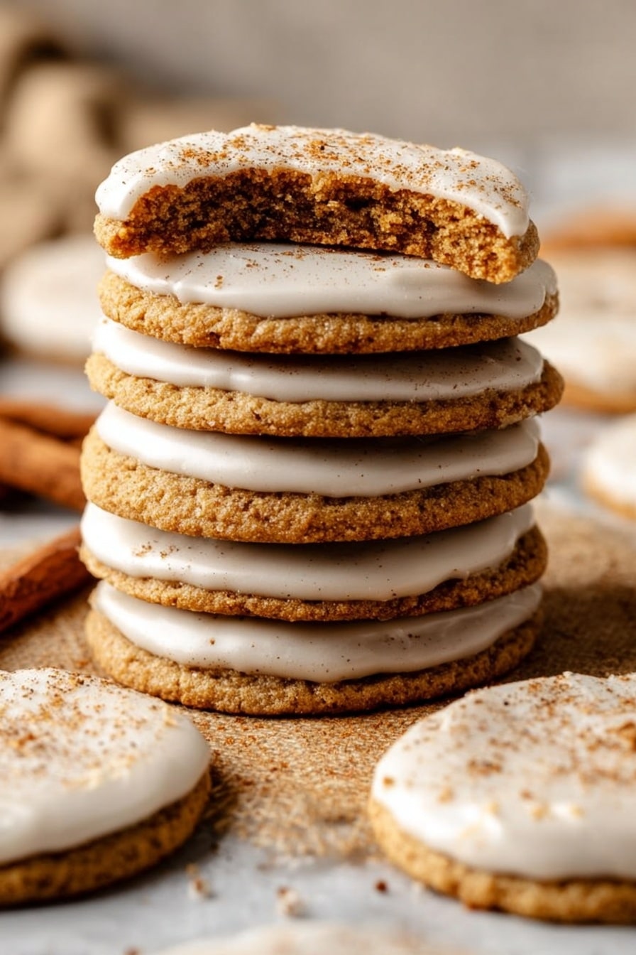 A tall stack of ten golden brown cookies with a smooth white icing layer on top, the top cookie is broken in half showing a soft brown interior. Around the stack, there are more iced cookies placed on a white marbled surface. The cookies have a rough texture with some sprinkled cinnamon on the icing. The scene is warm and cozy with soft lighting. photo taken with an iphone --ar 2:3 --v 7 - Brown Sugar Cookie Pop-Tarts, Easy homemade Pop-Tarts, Cinnamon-filled cookie pastries, Baking comfort food, Unique breakfast treats