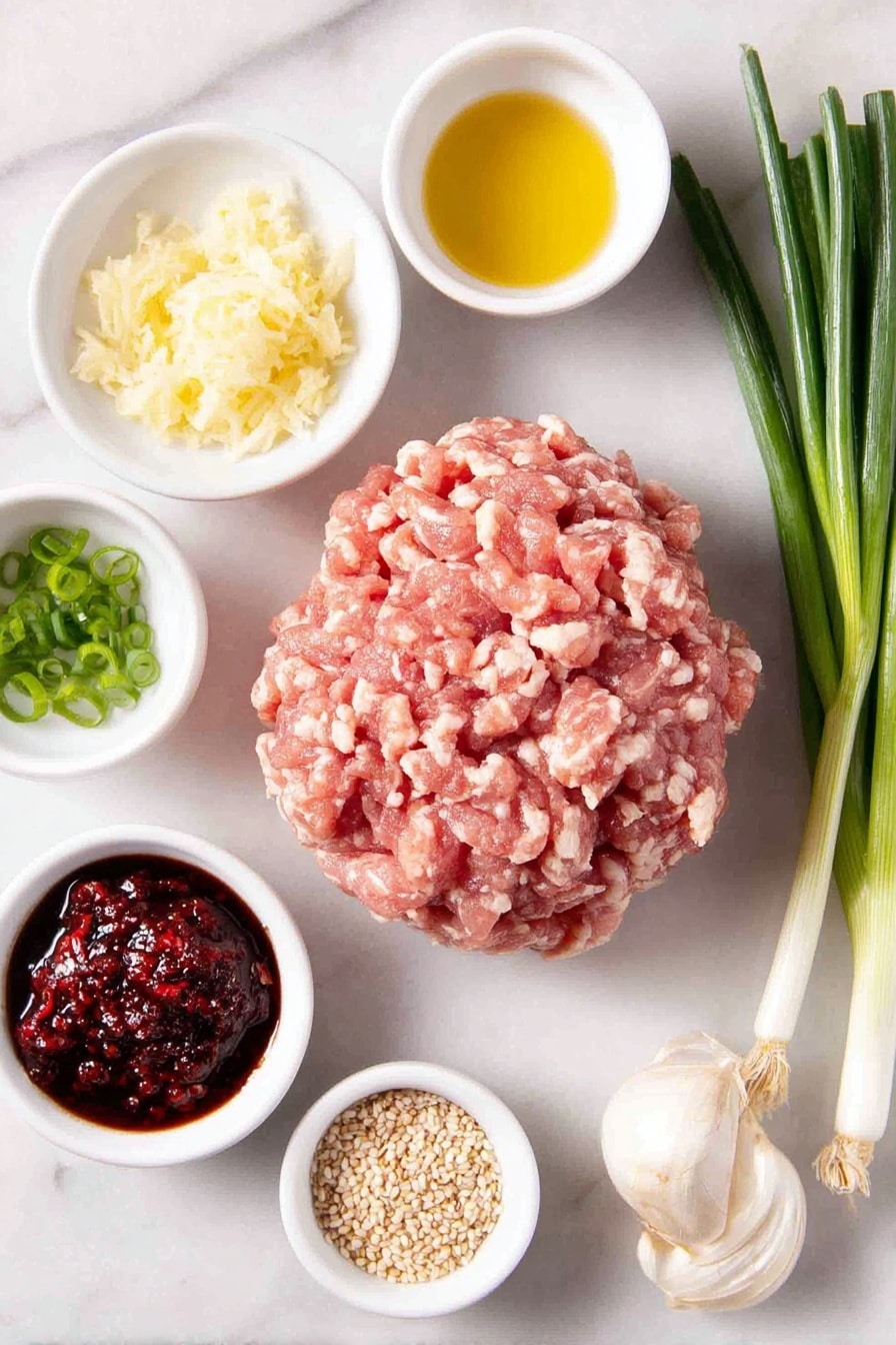 Flat lay of a mound of fresh ground chicken showing light and dark meat, a small bunch of whole scallions with green and white parts, a small white bowl with freshly grated ginger and juice, a small white bowl with grated garlic cloves, two small white bowls each containing gluten-free tamari sauce, a small white bowl with golden avocado oil, a few thinly sliced scallions arranged neatly, a small white bowl with rich red chili sambal, a small white bowl with toasted sesame seeds, all balanced symmetrically and placed on a clean white marble surface, soft natural light, photo taken with an iPhone, professional food photography style, fresh ingredients, white ceramic bowls, no bottles, no duplicates, no utensils, no packaging --ar 2:3 --v 7 --p m7354615311229779997 - Asian Chicken Meatballs, healthy chicken meatballs, Asian-inspired dinner, flavorful chicken meatballs, easy Asian meatball recipe
