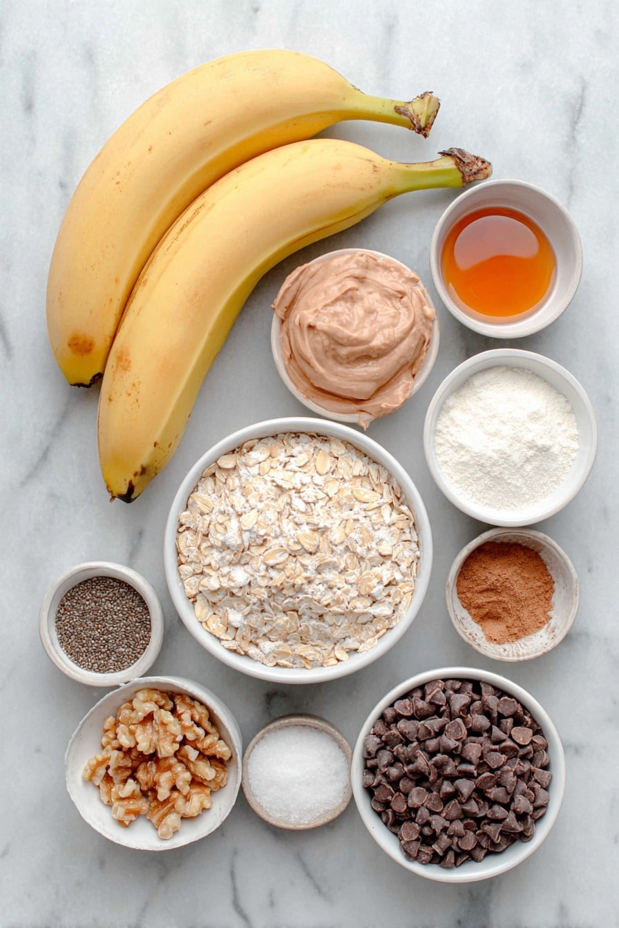 Flat lay of two large extra ripe bananas, a small white bowl of natural peanut butter, a small white bowl of pure maple syrup, one whole uncracked large egg with clean shell, a small white bowl of pure vanilla extract, a small white bowl of oat flour, a small white bowl of flaxseed meal, a small white bowl of ground cinnamon, a small white bowl of baking soda, a small white bowl of kosher salt, a small white bowl of old fashioned rolled oats, a small white bowl of hemp hearts, a small white bowl of chia seeds, a small white bowl of semi-sweet chocolate chips, a small white bowl of chopped walnuts, and a small white bowl with flaky sea salt, all arranged in perfect symmetry on a clean white marble surface, soft natural light, photo taken with an iPhone, professional food photography style, fresh ingredients, white ceramic bowls, no bottles, no duplicates, no utensils, no packaging --ar 2:3 --v 7 --p m7354615311229779997 - Healthy Banana Breakfast Cookies, healthy breakfast ideas, easy nutritious cookies, homemade health snacks, banana oatmeal cookies