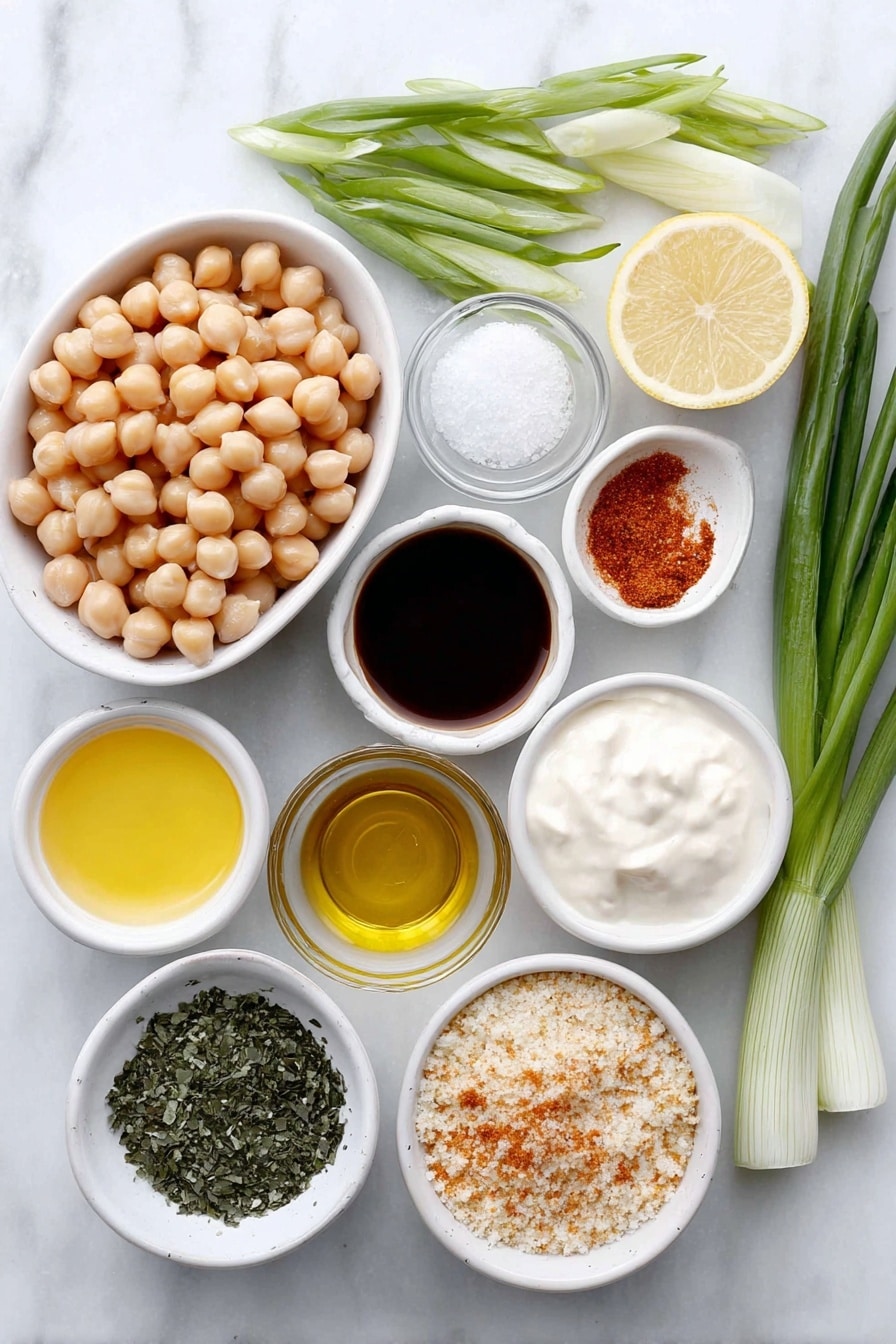 Flat lay of whole garbanzo beans in a pile, fresh hearts of palm stalks halved lengthwise, a small white ceramic bowl of reserved garbanzo bean liquid foamy, a small white ceramic bowl of creamy vegan mayonnaise, a small white ceramic bowl of bright yellow lemon juice, a small white ceramic bowl of deep brown vegan Worcestershire sauce, a small white ceramic bowl of smooth Dijon mustard, fresh green onions sliced, a small white ceramic bowl of dark green kelp granules, dried bright green parsley flakes, vibrant reddish-orange Old Bay seasoning powder, coarse sea salt crystals, granulated garlic powder, a small white ceramic bowl filled with light golden breadcrumbs, a small white ceramic bowl of pale golden oil, arranged with perfect symmetry and balanced proportions, placed on a clean white marble surface, soft natural light, photo taken with an iPhone, professional food photography style, fresh ingredients, white ceramic bowls, no bottles, no duplicates, no utensils, no packaging --ar 2:3 --v 7 --p m7354615311229779997 - Hearts of Palm Crab Cakes, plant-based crab cakes, vegan crab cakes recipe, easy seafood alternative recipes, flaky vegetable cakes