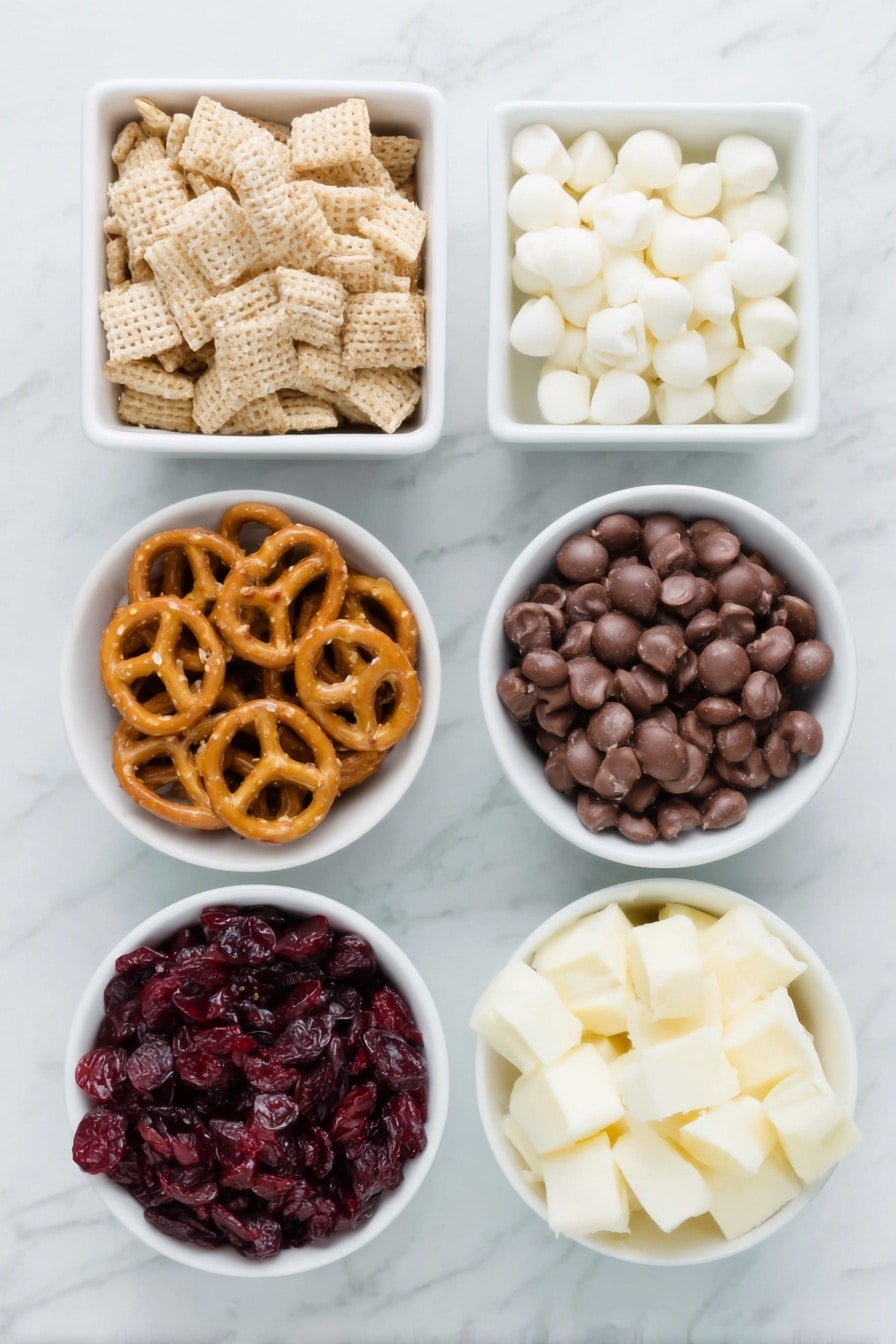 Flat lay of a small mound of rice Chex cereal, a neat pile of Cheerios, a small cluster of twisted pretzels, a handful of colorful M&M candies, a small bowl filled with plump dried cranberries, and a small white ceramic bowl containing smooth white chocolate chips, all arranged symmetrically on a clean white marble surface, soft natural light, photo taken with an iPhone, professional food photography style, fresh ingredients, white ceramic bowls, no bottles, no duplicates, no utensils, no packaging --ar 2:3 --v 7 --p m7354615311229779997 - White Chocolate Party Mix, Party Mix Recipe, Sweet and Salty Snack, Easy Festive Treat, Chex and Cheerios Mix