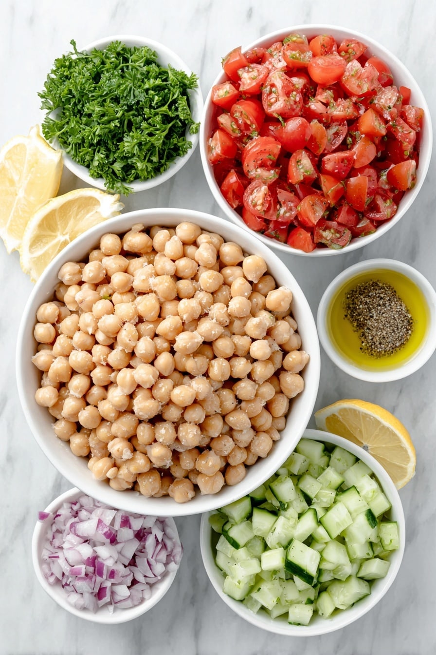 Flat lay of a small pile of fresh chickpeas, a handful of partially peeled diced cucumbers, a small heap of diced seeded tomatoes, a small mound of finely diced red onion, a few sprigs of bright green fresh parsley, a small white bowl of extra virgin olive oil, a small white bowl of fresh lemon juice, a small white bowl with kosher salt and freshly ground black pepper placed neatly, all arranged symmetrically on a simple white ceramic surface, placed on a clean white marble surface, soft natural light, photo taken with an iPhone, professional food photography style, fresh ingredients, white ceramic bowls, no bottles, no duplicates, no utensils, no packaging --ar 2:3 --v 7 --p m7354615311229779997 - Refreshing Chickpea Salad with Cucumber and Tomato, healthy chickpea salad, quick vegetarian salad, vibrant summer salad, easy chickpea salad