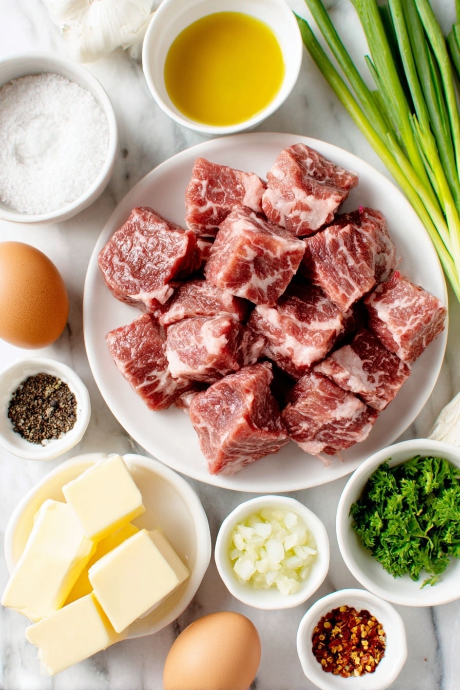 Flat lay of fresh raw steak pieces cut into bite size chunks, a small white bowl of golden avocado oil, whole uncracked brown eggs nearby (representing protein but optional if not in recipe), a small white bowl filled with coarse sea salt, a small white bowl containing freshly ground black pepper, a small white bowl with red pepper flakes, a small white bowl with creamy yellow butter, several fresh garlic cloves and a small pile of minced garlic, a handful of bright green chopped parsley, and a few whole vibrant green onions with their white bulbs intact, all arranged symmetrically on simple white ceramic dishes and bowls, placed on a clean white marble surface, soft natural light, photo taken with an iPhone, professional food photography style, fresh ingredients, white ceramic bowls, no bottles, no duplicates, no utensils, no packaging --ar 2:3 --v 7 --p m7354615311229779997 - Garlic Butter Steak Bites, Garlic Butter Steak Bites recipe, easy steak bites, flavorful steak appetizer, quick weeknight steak
