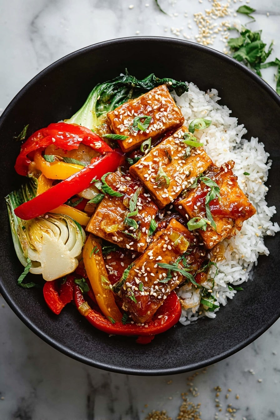 A white bowl holds a colorful dish with three main layers; the bottom layer is white rice with soft, small grains; the middle layer has cooked mixed vegetables including red and yellow bell pepper strips and light green bok choy pieces, all with a slightly glossy, saucy coating; the top layer features several rectangular golden-brown tofu pieces sprinkled with white sesame seeds and small green herb leaves, adding a fresh touch. The bowl is set on a white marbled surface with small bits of herbs and sesame scattered around. photo taken with an iphone --ar 2:3 --v 7 - Tofu Stir Fry, healthy tofu stir fry, easy stir fry recipes, vegetable stir fry, quick dinner ideas