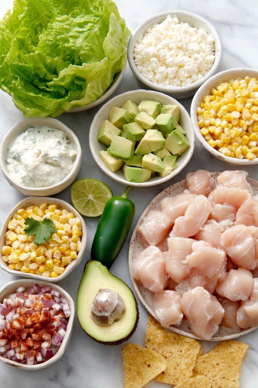 Flat lay of boneless skinless chicken breast pieces arranged neatly, a small mound of uncooked jasmine rice grains, fresh whole jalapeño pepper, a quarter of a ripe avocado diced, a handful of bright green cilantro leaves, a wedge of lime cut in half with visible juices, white ceramic bowls holding sweet yellow corn kernels, creamy light sour cream, light mayonnaise, crumbled white cotija cheese, and chili powder sprinkled on a small white bowl, accompanied by fresh green lettuce leaves, diced red onions, vibrant red pico de gallo, and scattered golden tortilla chips all placed on a clean white marble surface, soft natural light, photo taken with an iPhone, professional food photography style, fresh ingredients, white ceramic bowls, no bottles, no duplicates, no utensils, no packaging --ar 2:3 --v 7 --p m7354615311229779997 - Street Corn Chicken Rice Bowls, street corn chicken bowls, flavorful chicken rice bowls, easy Mexican-inspired rice bowls, zesty street corn dishes