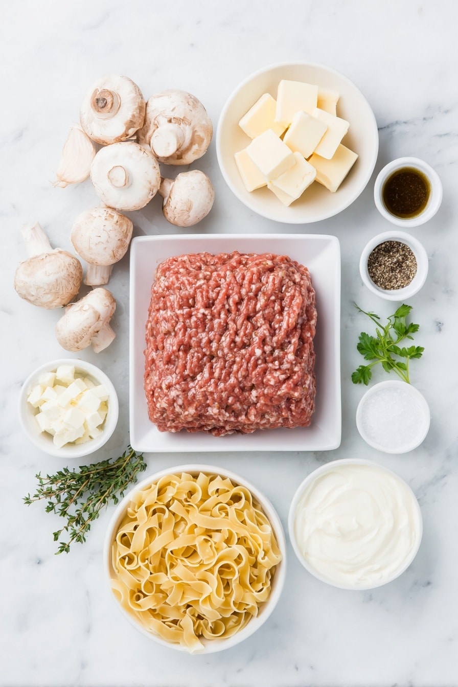 Flat lay of wide egg noodles uncooked in a small white ceramic bowl, a portion of fresh ground beef shaped loosely on a white plate, a few whole white mushrooms with brown caps arranged beside the beef, half a yellow onion diced on a white square dish, three whole garlic cloves with skins intact, a small white ceramic bowl with unsalted butter cubes, another small bowl holding cream cheese, a fresh sprig of thyme beside a sprig of parsley, a small white ceramic bowl filled with sour cream, a separate small white bowl containing Dijon mustard, a small white bowl with Worcestershire sauce, salt and pepper grains arranged simply side by side in tiny white bowls, all placed on a clean white marble surface, soft natural light, photo taken with an iPhone, professional food photography style, fresh ingredients, white ceramic bowls, no bottles, no duplicates, no utensils, no packaging --ar 2:3 --v 7 --p m7354615311229779997 - One-Pot Ground Beef Stroganoff, easy ground beef dinner, creamy beef stroganoff, quick weeknight meals, hearty beef recipes